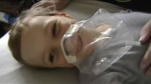 Dylan with his respiratory mask on